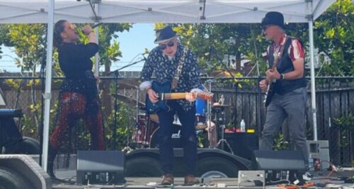 Lead guitar player in hat