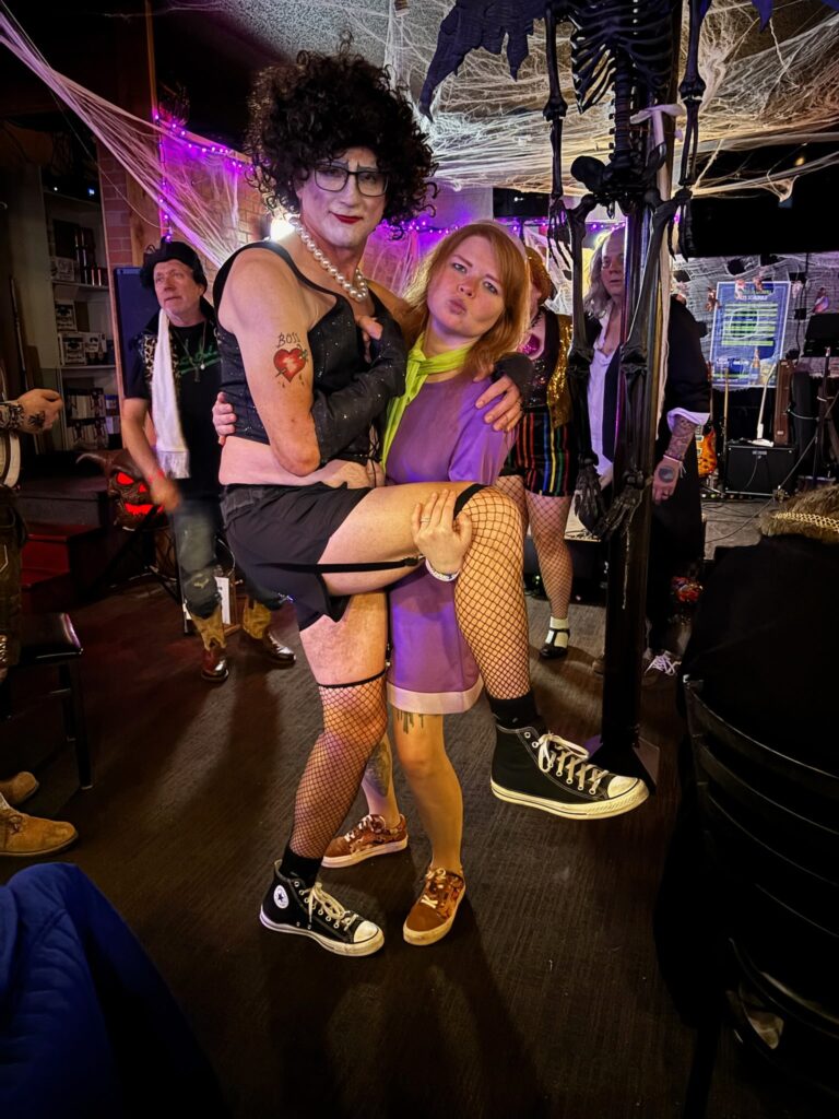 Man and woman in Halloween costumes