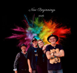 4 band members, one female and 3 males standing in front of a colorful fireworks display. Text above image is "New Beginnings"